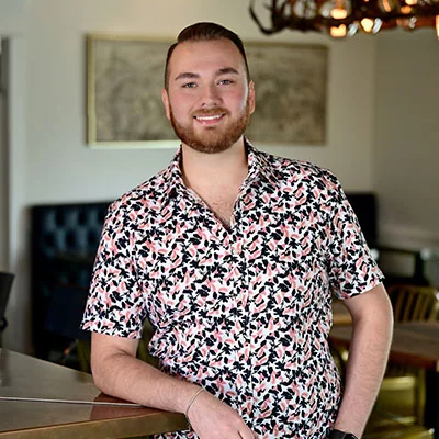 General Manager Justin Syzdek standing in the dining room.